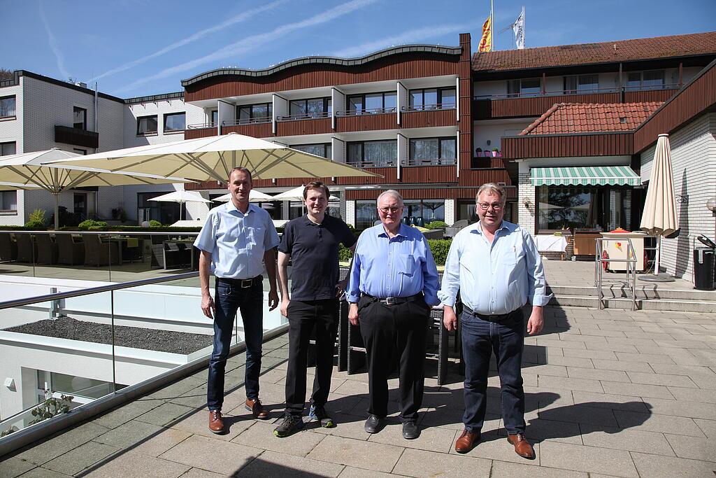 Group image of people in front of the hotel